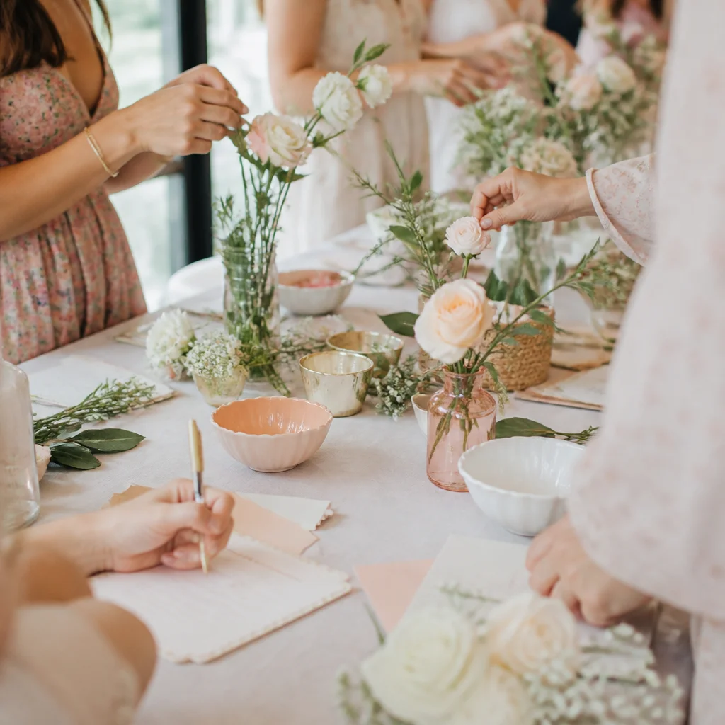 Interactive baby shower activity table with recipe cards, flowers, and handwritten notes